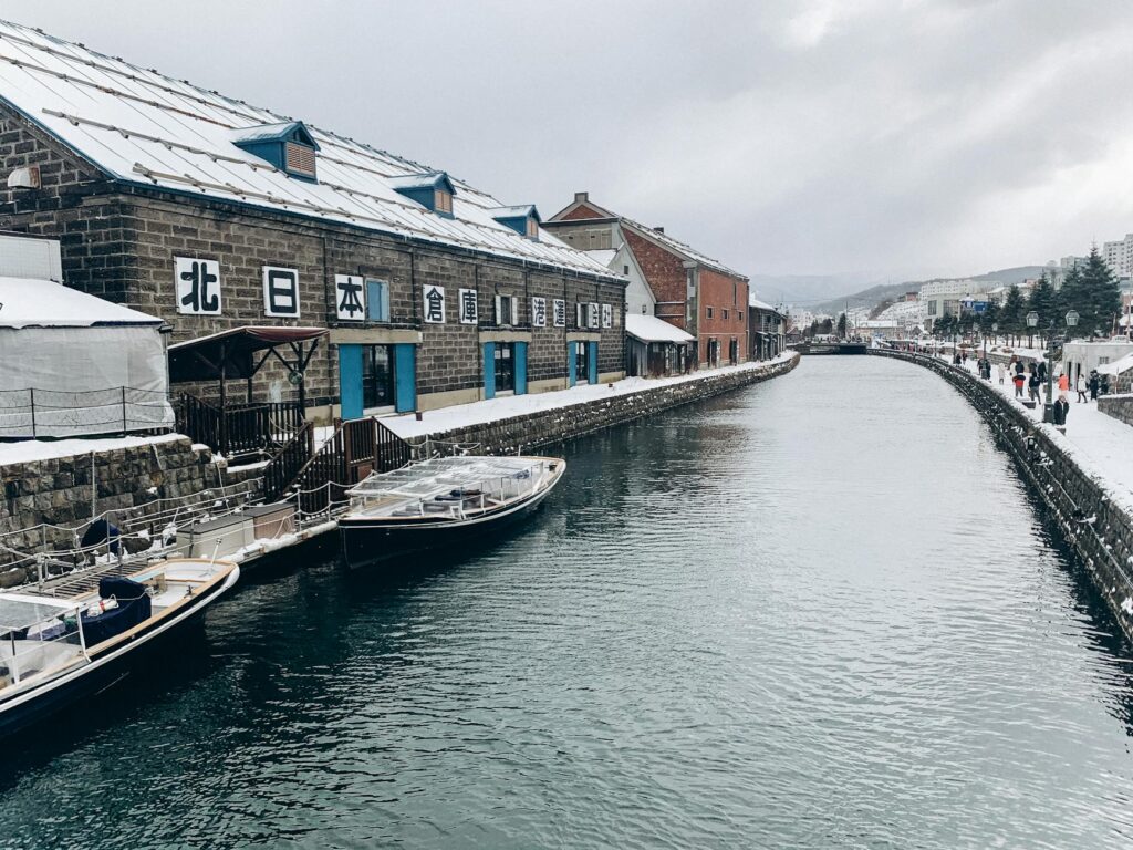 photo of a river and buildings in winter