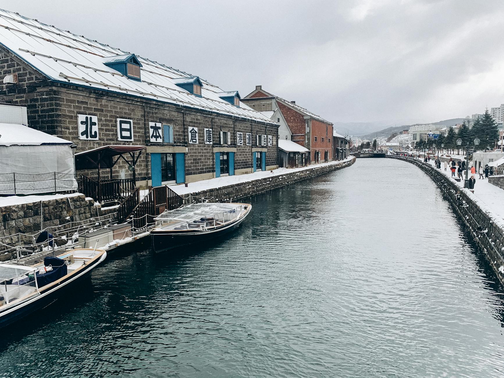 photo of a river and buildings in winter